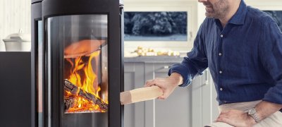 Man using his Jøtul wood stoves