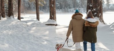 Couple going out with the dog in the woods