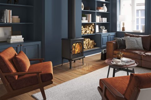 Jøtul F 200 black and small wood burning stove in a dark blue living room